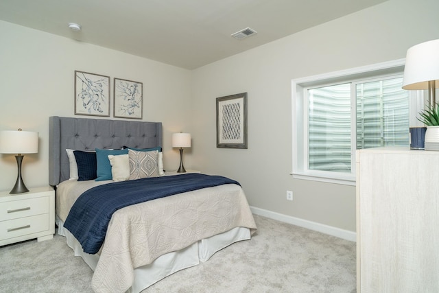 bedroom with visible vents, baseboards, and carpet floors