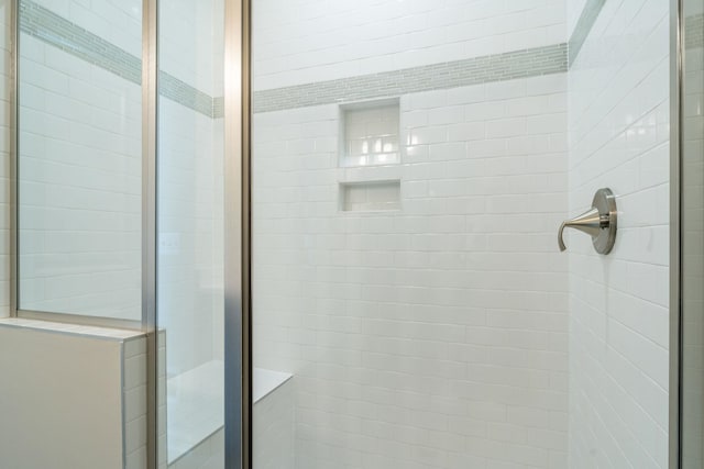 bathroom featuring a shower stall