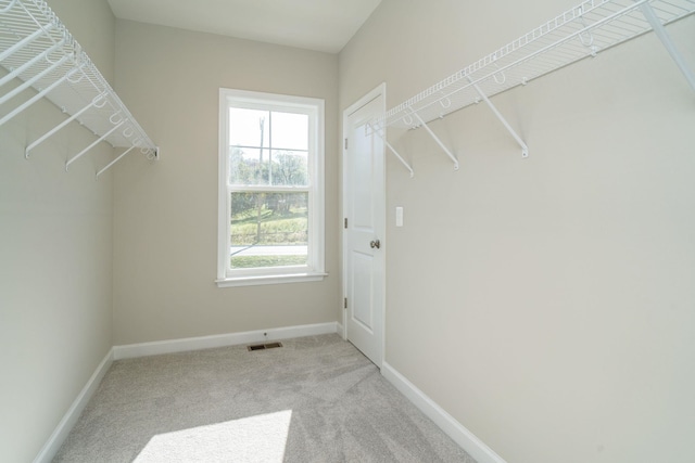 walk in closet with carpet and visible vents