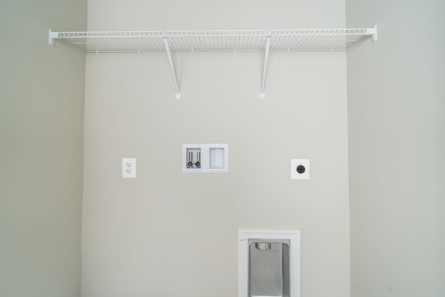 clothes washing area featuring electric dryer hookup, washer hookup, and laundry area