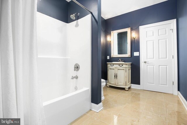 full bathroom featuring vanity, toilet, bathing tub / shower combination, and tile patterned flooring