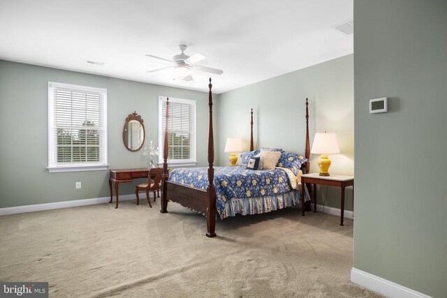 carpeted bedroom featuring ceiling fan