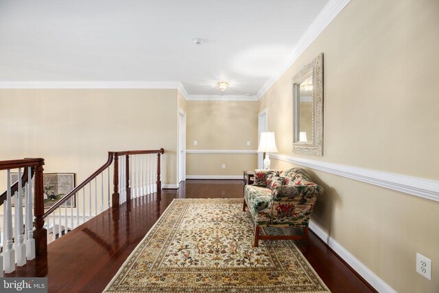 hallway featuring dark wood-type flooring and ornamental molding