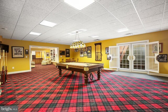 rec room featuring a drop ceiling, pool table, french doors, and carpet