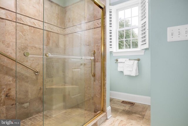 bathroom featuring an enclosed shower