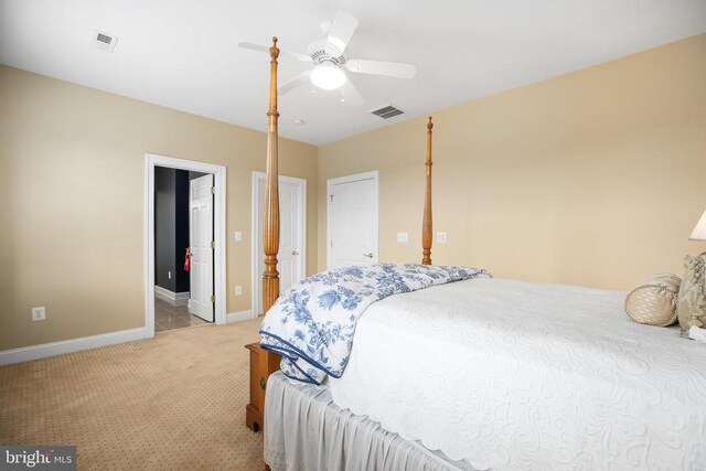 carpeted bedroom with ceiling fan