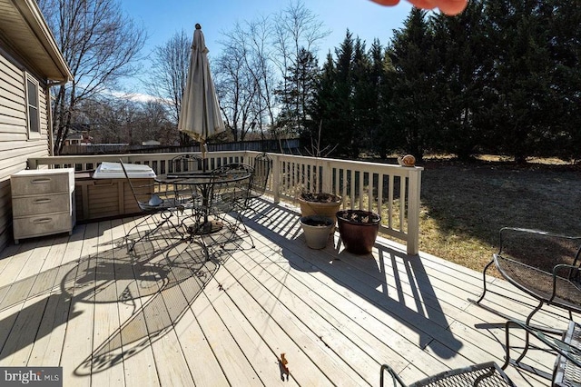 wooden terrace with outdoor dining space