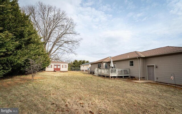 view of yard with a wooden deck