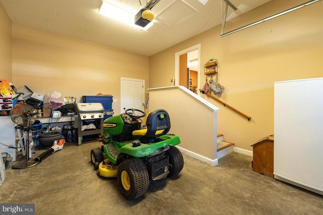 garage with baseboards and a garage door opener