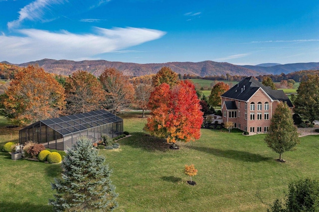 drone / aerial view featuring a mountain view