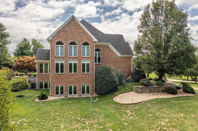 view of side of property with a yard