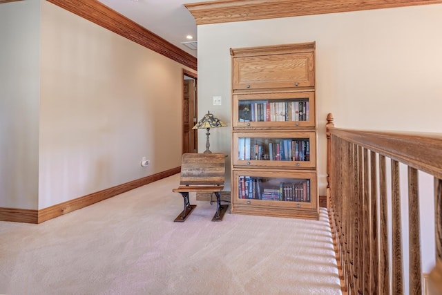 living area featuring crown molding and light carpet