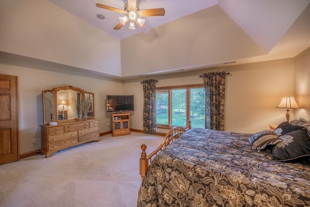 carpeted bedroom featuring ceiling fan and high vaulted ceiling