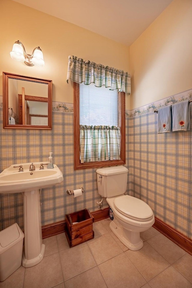 bathroom featuring tile patterned floors and toilet