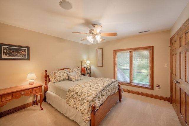 bedroom featuring ceiling fan and light colored carpet