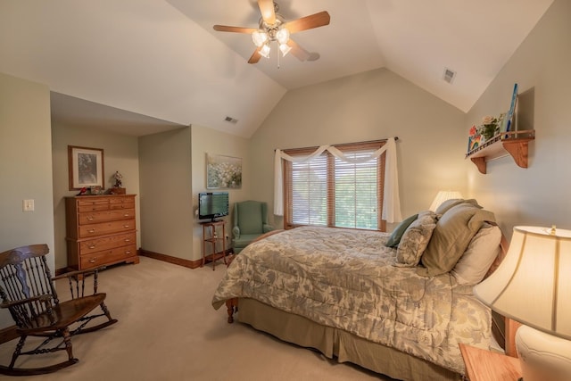 bedroom featuring lofted ceiling, light colored carpet, and ceiling fan