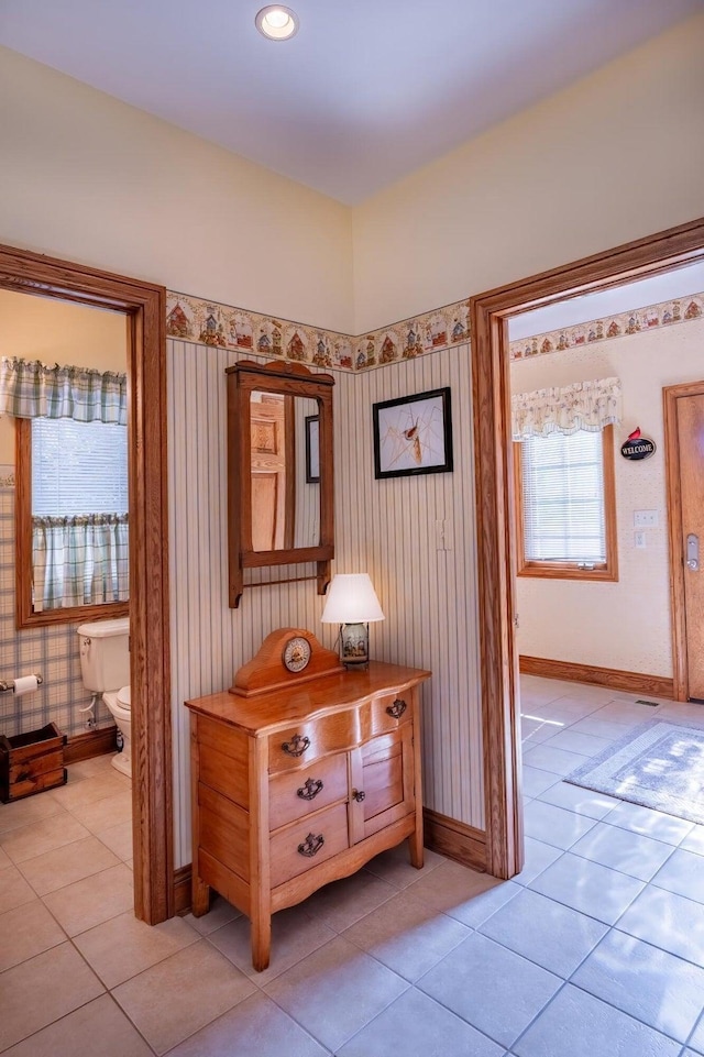 corridor with light tile patterned flooring