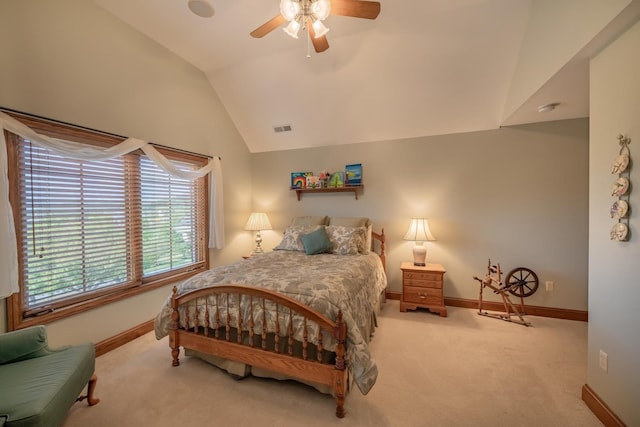 bedroom featuring light carpet, vaulted ceiling, and ceiling fan