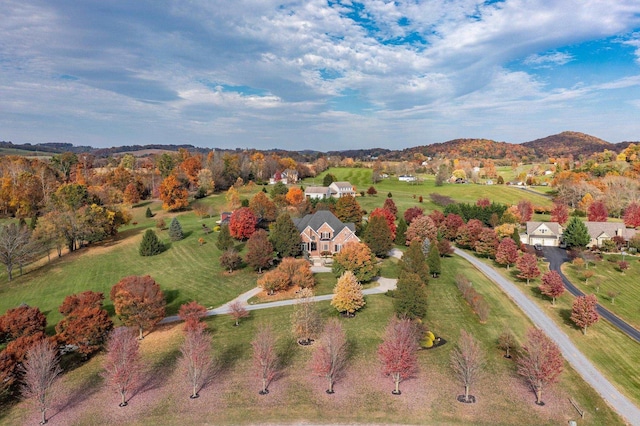 birds eye view of property featuring a mountain view and a rural view