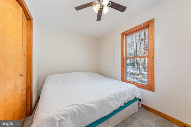 bedroom with light colored carpet and ceiling fan