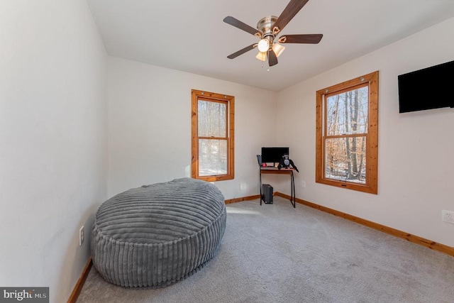 interior space featuring carpet flooring and ceiling fan