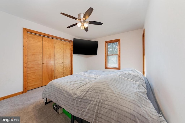 bedroom with carpet floors, a closet, and ceiling fan