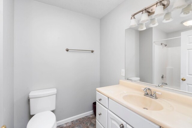 full bathroom with vanity, washtub / shower combination, and toilet