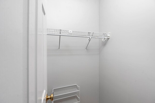 walk in closet featuring heating unit