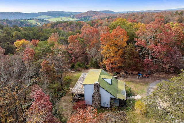 aerial view featuring a mountain view and a wooded view