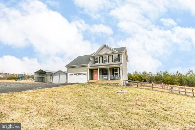 view of front of house featuring a porch, aphalt driveway, a garage, fence, and a front yard