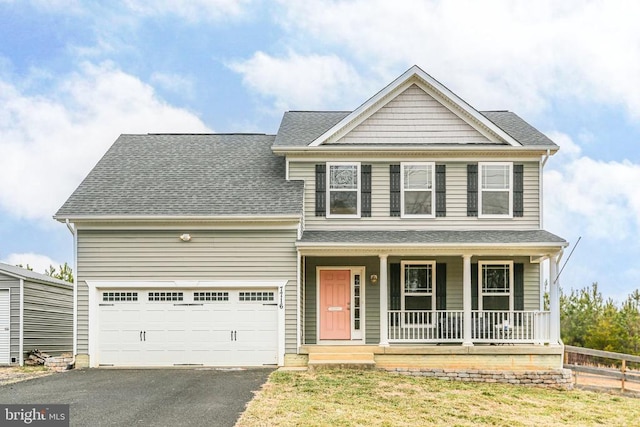 view of front of home featuring a shingled roof, a porch, and aphalt driveway