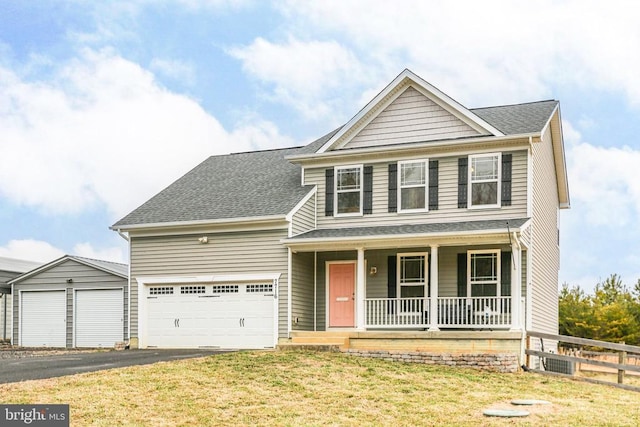 view of front of home featuring roof with shingles, covered porch, a front yard, fence, and driveway