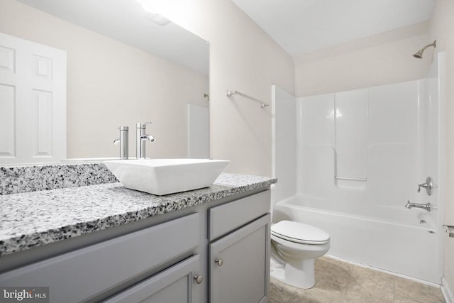 bathroom featuring toilet, bathing tub / shower combination, and vanity