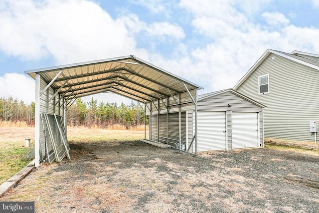 view of parking with a carport and driveway