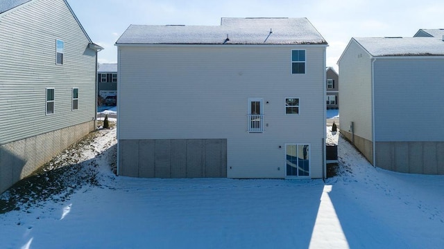 view of snow covered house