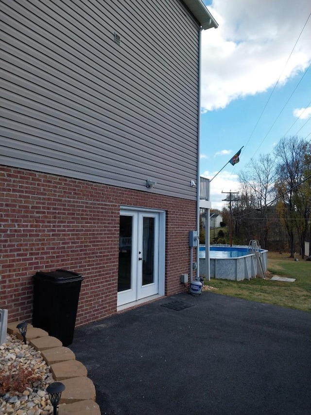 view of side of home with french doors