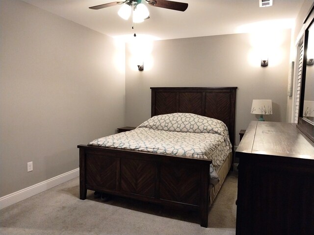 bedroom with ceiling fan and light colored carpet