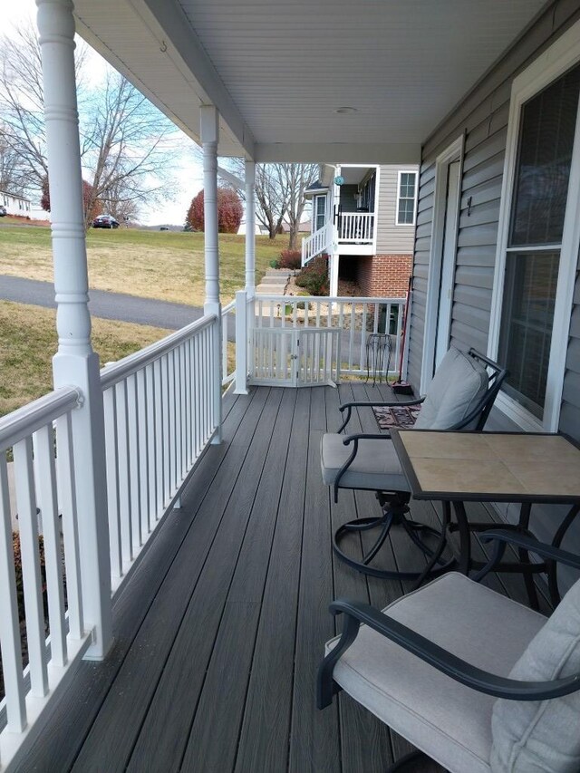 wooden deck featuring a porch