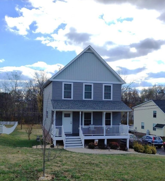 view of front of house featuring a porch and a front lawn