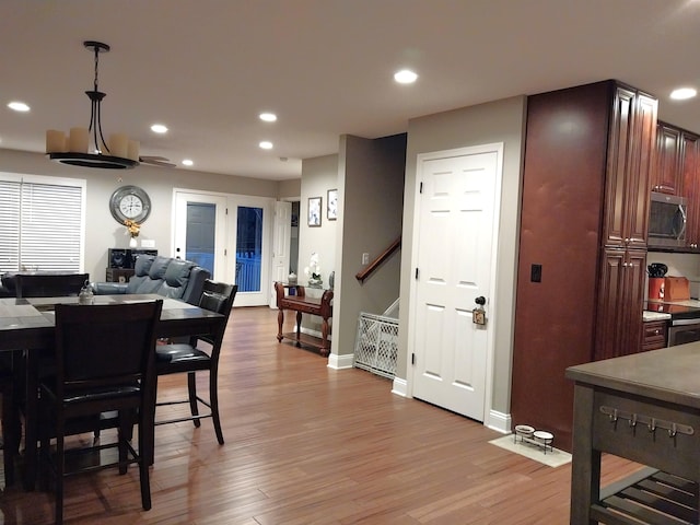 dining area featuring light wood-type flooring