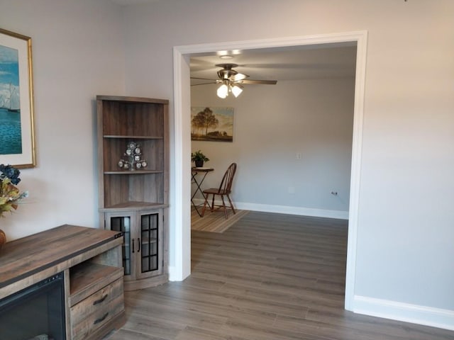 dining area featuring ceiling fan and dark hardwood / wood-style flooring