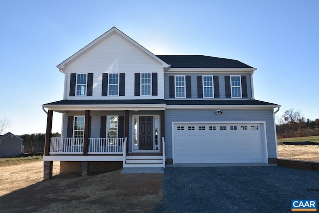 view of front of home featuring a garage and covered porch