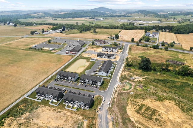 drone / aerial view with a mountain view and a rural view