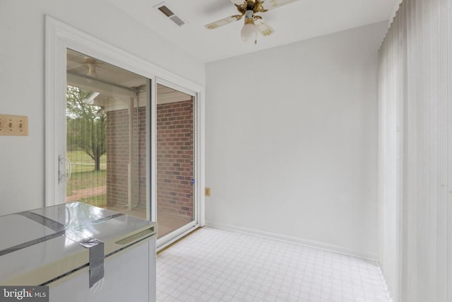 unfurnished dining area featuring visible vents, baseboards, light floors, and ceiling fan