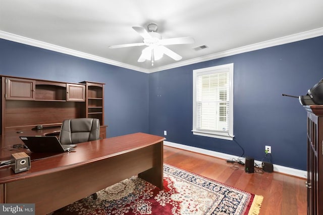 office with ceiling fan, ornamental molding, visible vents, wood finished floors, and baseboards