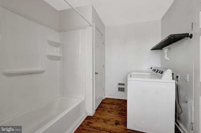 laundry area featuring laundry area, independent washer and dryer, and dark wood-style flooring