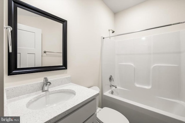 full bathroom with vanity, shower / tub combination, and toilet