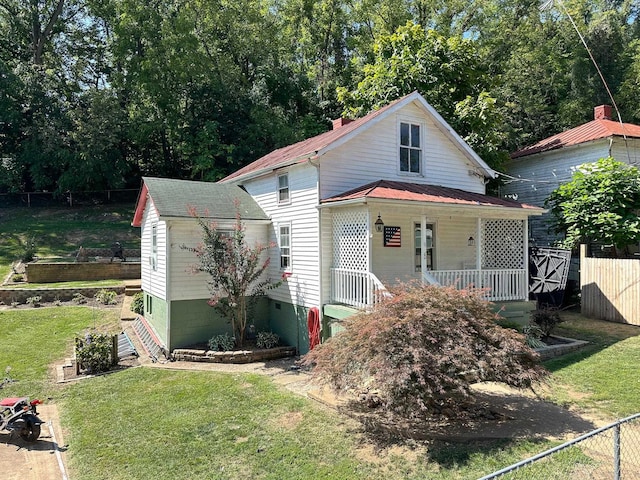 view of front of home with a front lawn and a porch