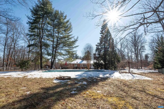 view of yard featuring a covered pool