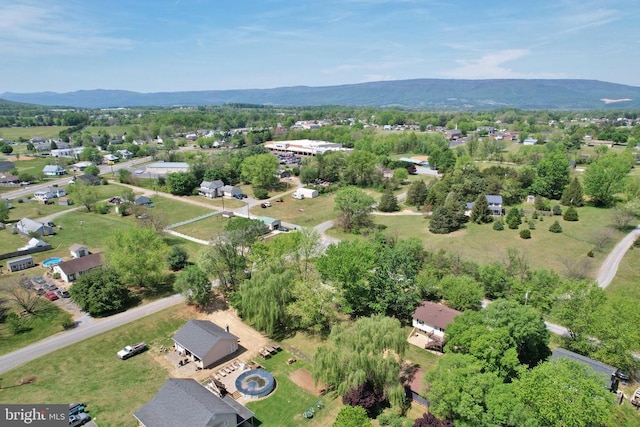 birds eye view of property featuring a mountain view
